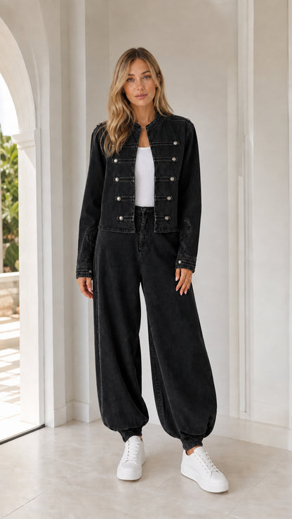 Front full view of woman wearing black utility jacket and matching pants