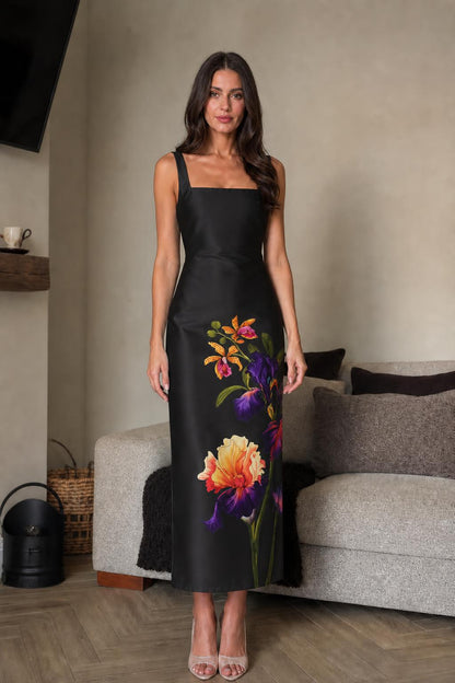 Front view of black floral midi dress on model