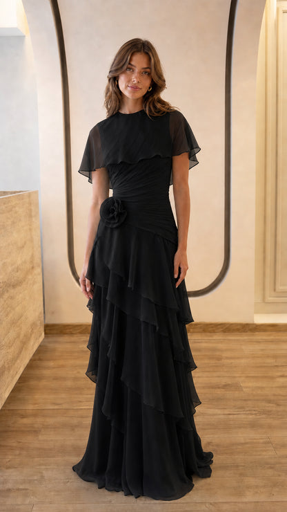 Full view of black chiffon capelet evening gown