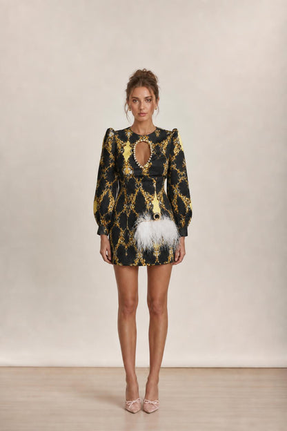 Model wearing black baroque print mini dress