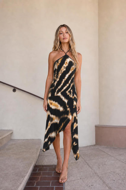 Front view of black printed halter midi dress