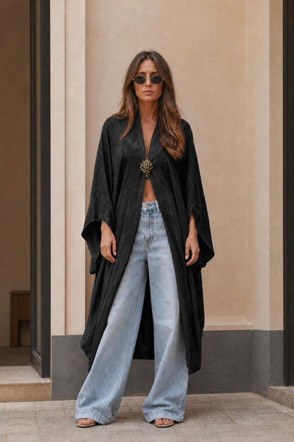 Model wearing black long kimono cardigan with open front