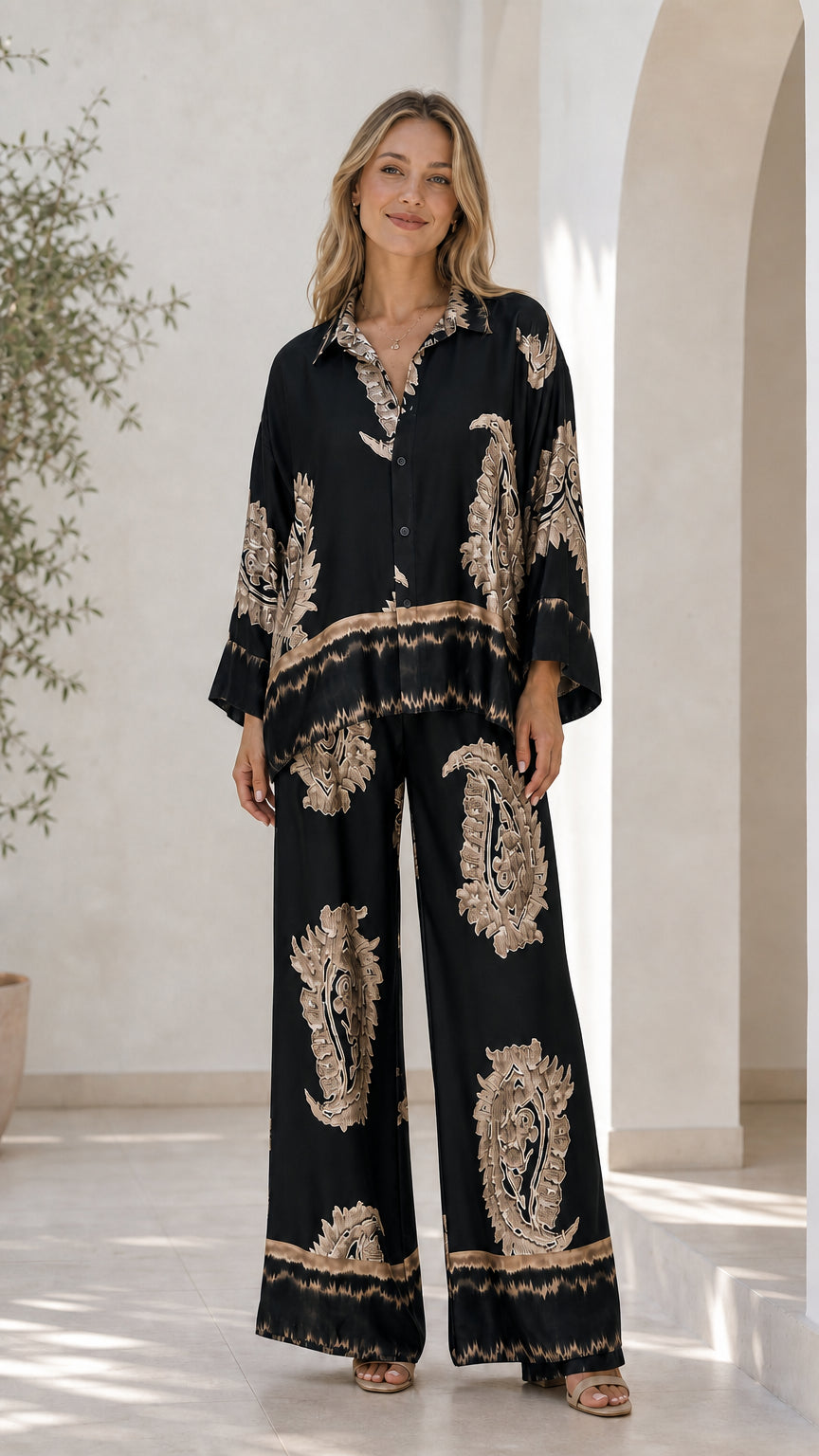 Front view of model in black satin paisley print lounge set