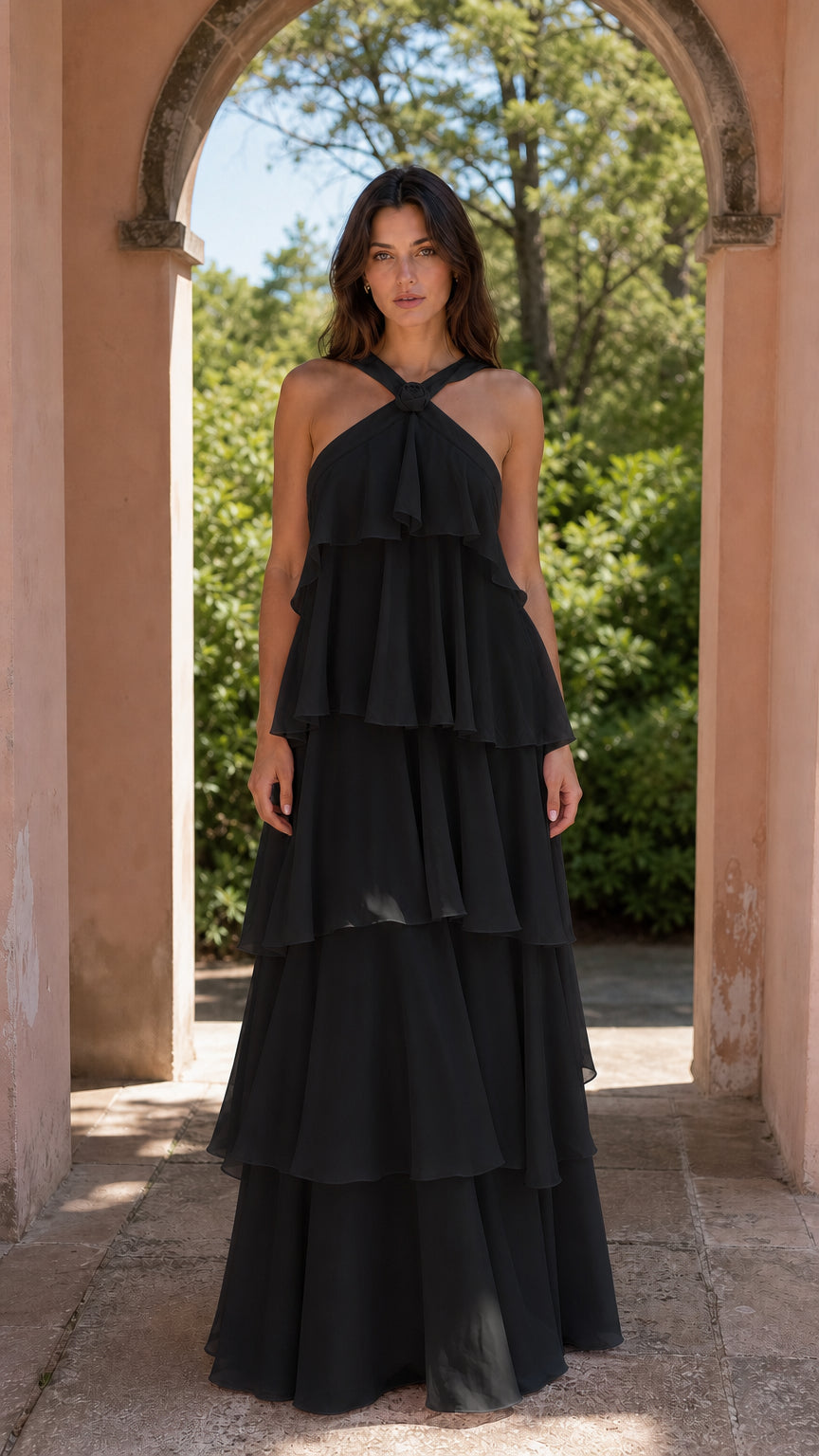 Model wearing black tiered maxi dress