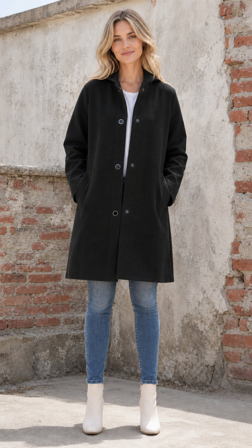 Front full view of woman wearing black hooded coat