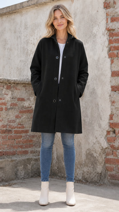 Front full view of woman wearing black hooded coat