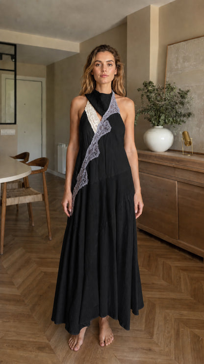 Front view of woman wearing black halter maxi dress