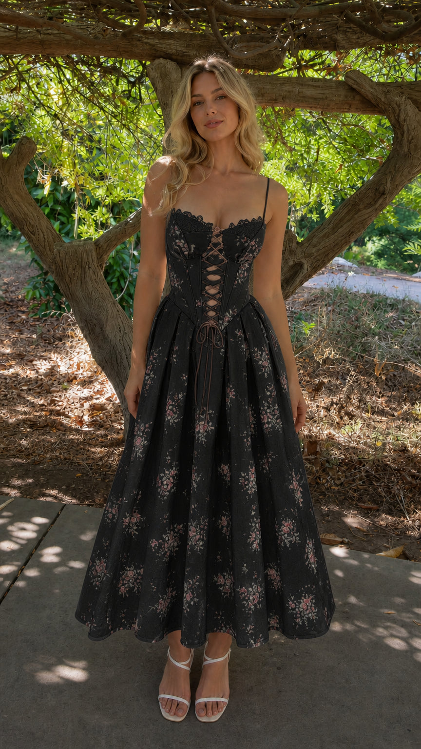 Woman wearing black floral corset midi dress