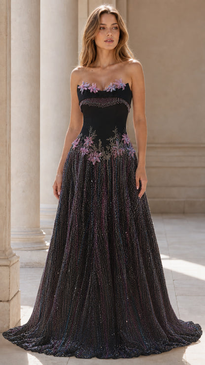 Front view of black strapless beaded evening gown