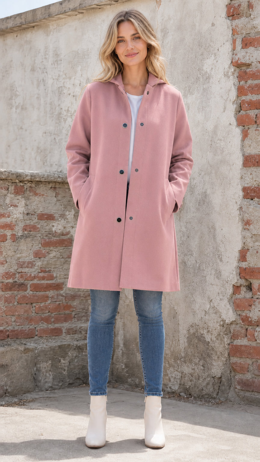 Front full view of woman wearing pink hooded coat