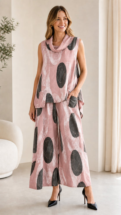 Front view of pink abstract print two-piece set on model