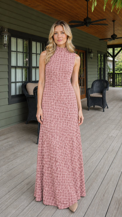 Front view of woman wearing pink textured sleeveless maxi dress