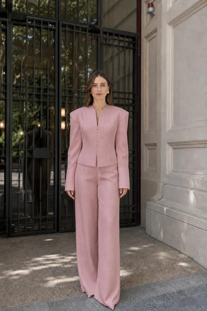 Model wearing pink pinstripe suit
