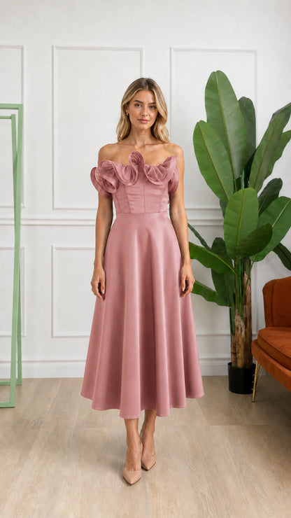 Front view of woman wearing dusty rose off-shoulder ruffle corset midi dress