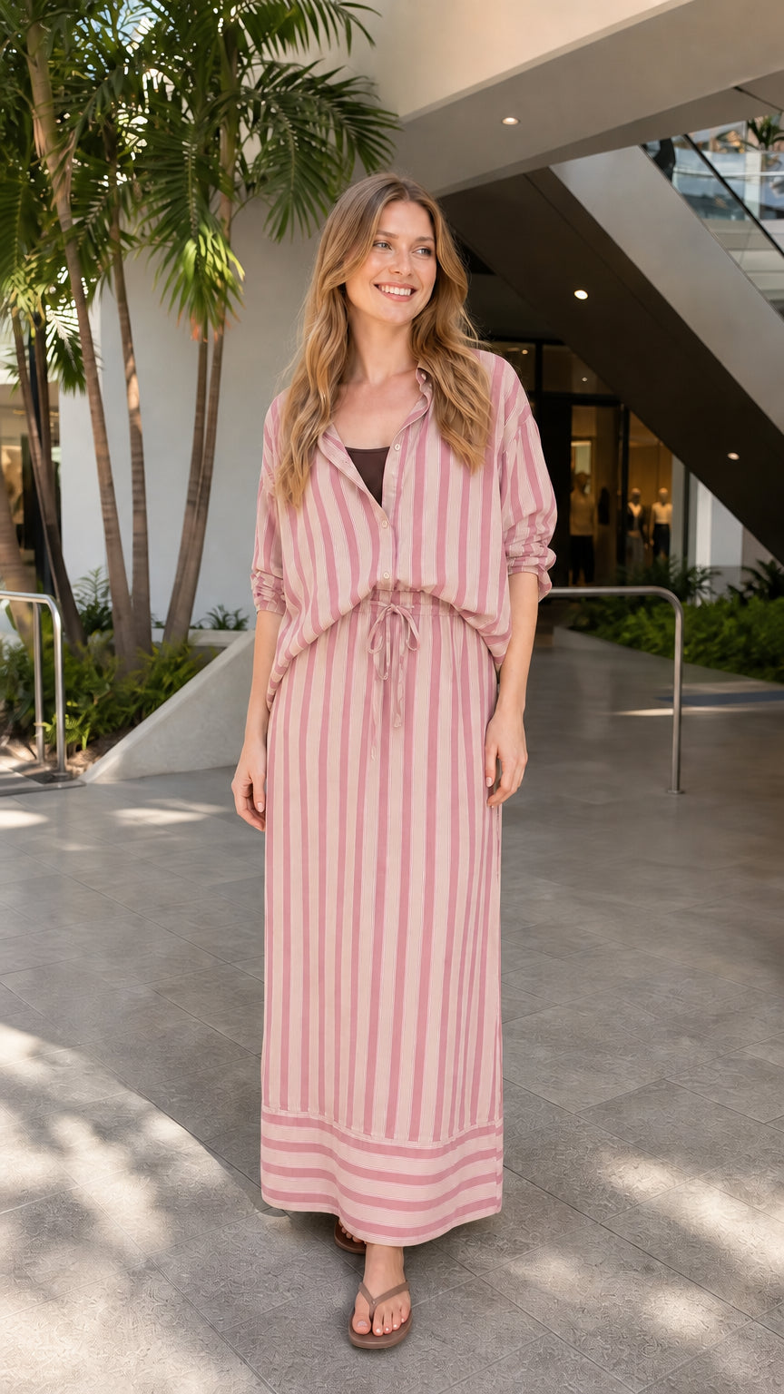 Model wearing pink striped two-piece set