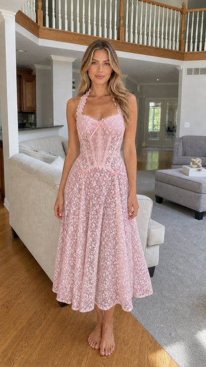 Woman wearing pink lace corset midi dress