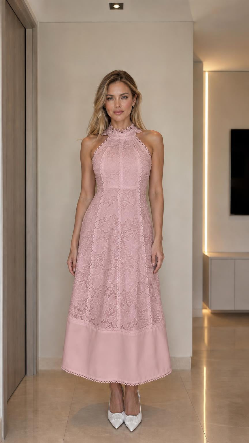 Front view of woman wearing pink halter neck lace midi dress