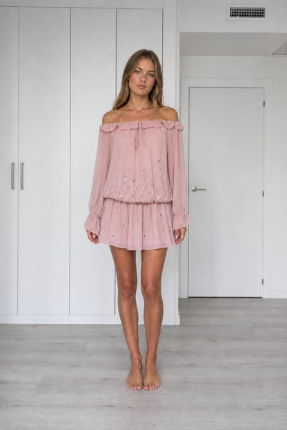 Front view of model wearing pink off-the-shoulder chiffon mini dress