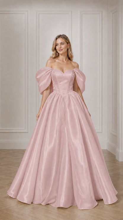 Full view of woman in pink off-the-shoulder satin ball gown