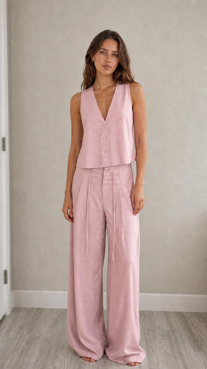 Full-length view of model in pink two-piece vest and pants set