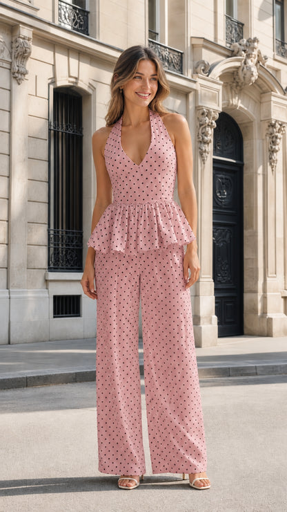 Front view of pink polka dot halter peplum jumpsuit
