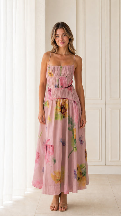 Front view of model wearing Pink floral smocked maxi dress
