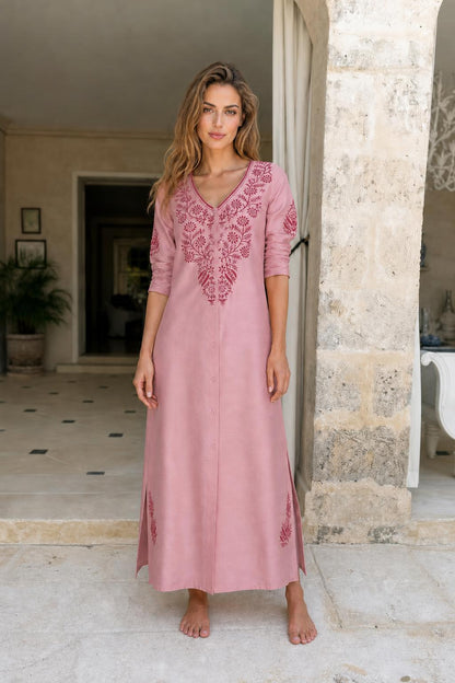 Model wearing pink embroidered maxi dress