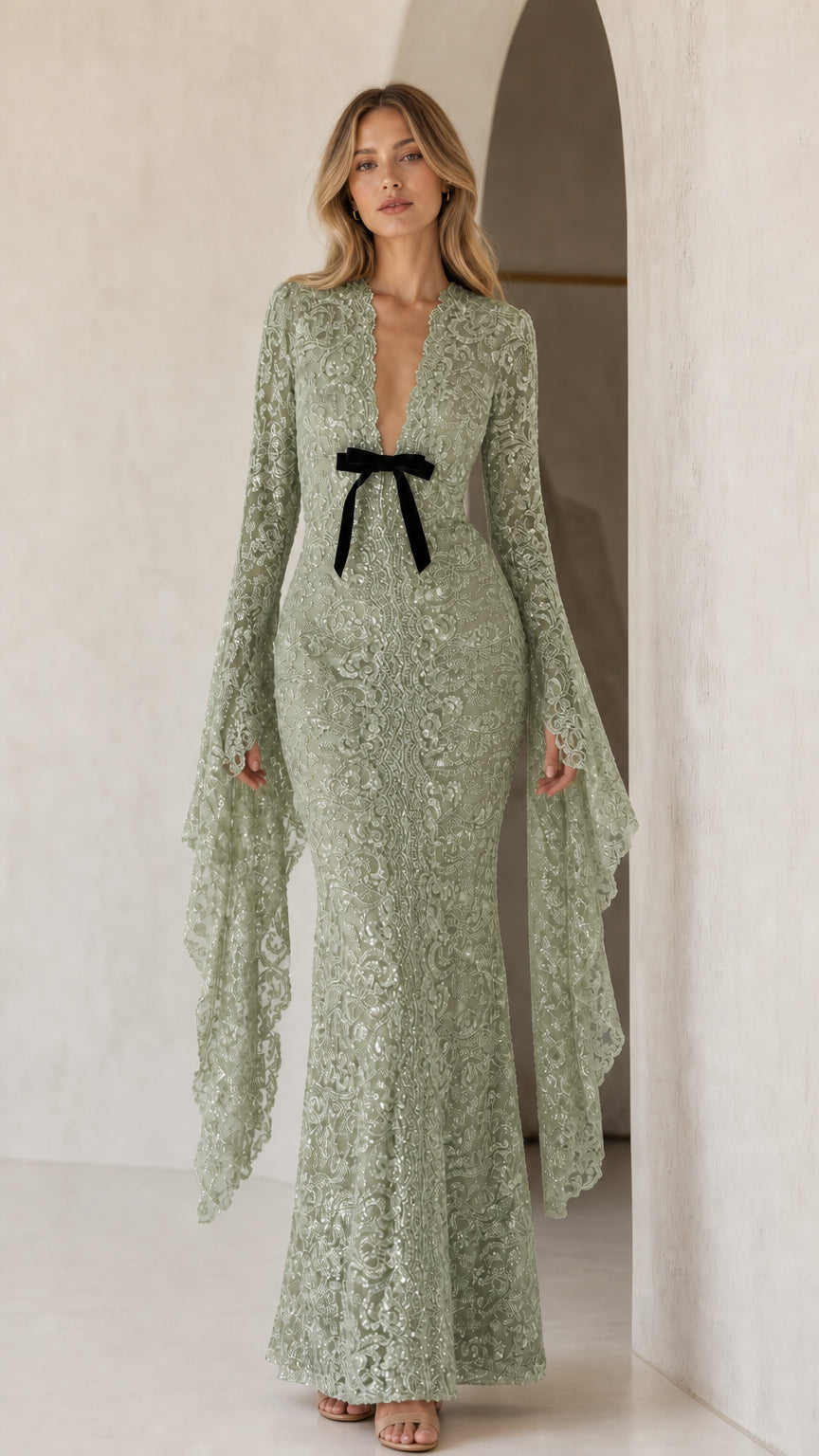 Model wearing sage sequin lace maxi dress