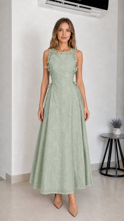 Model wearing sage green embroidered eyelet maxi dress