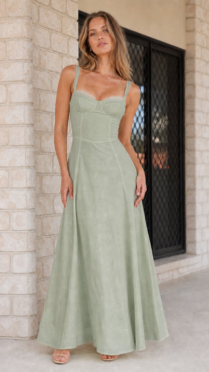 Woman wearing sage green corset maxi dress