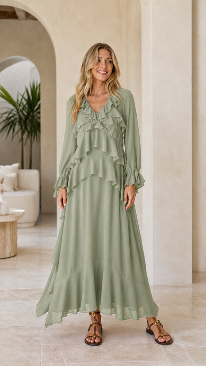 Model wearing green tiered ruffle long sleeve maxi dress