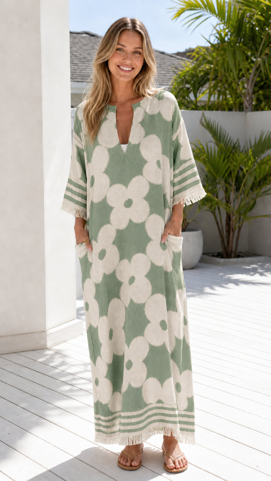 Woman wearing green and white floral jacquard maxi dress