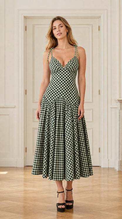Front view of model wearing green and white gingham midi dress