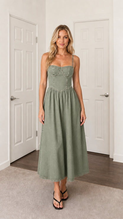 Front view of woman wearing green denim midi dress