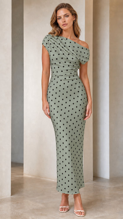 Front view of model wearing sage polka dot one-shoulder dress
