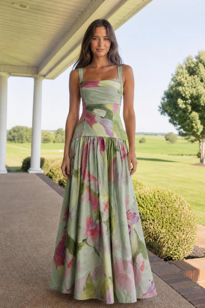 Front view of model wearing sage green floral print maxi dress