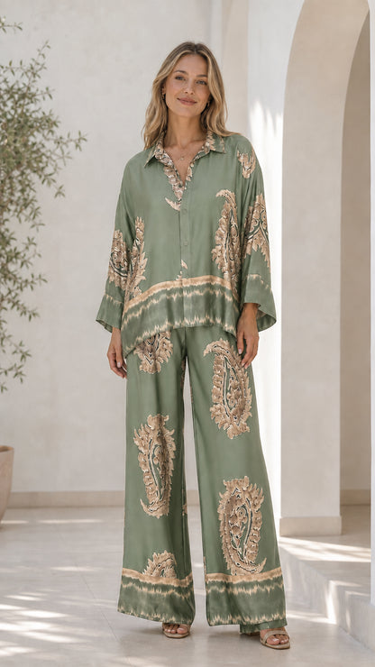 Front view of model in sage green satin paisley print lounge set