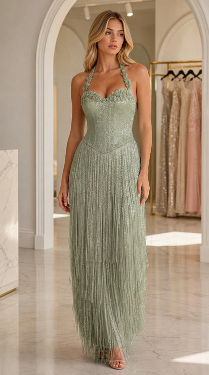 Full-length view of model in sage green glitter sequin halter fringe dress