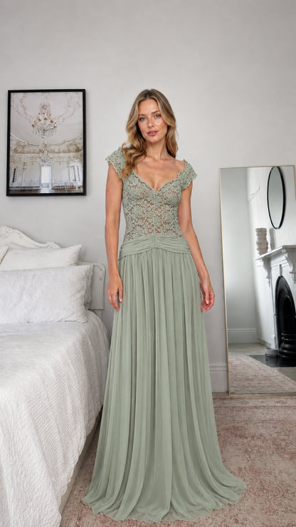Front view of model wearing sage green lace evening dress