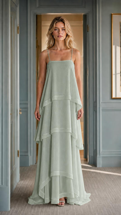Front view of woman wearing sage green tiered maxi dress