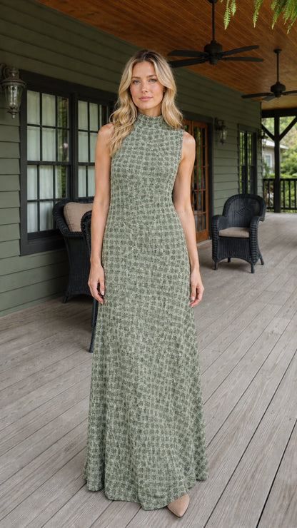 Front view of woman wearing sage green textured sleeveless maxi dress
