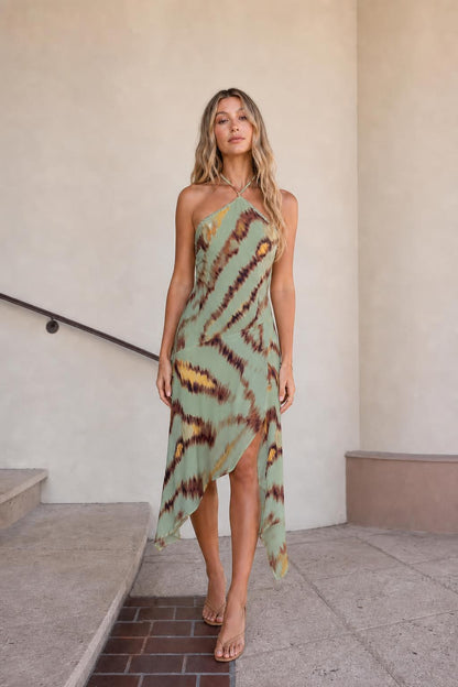 Front view of green printed halter midi dress