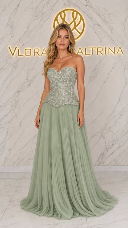 Front view of model wearing sage green strapless embellished corset gown