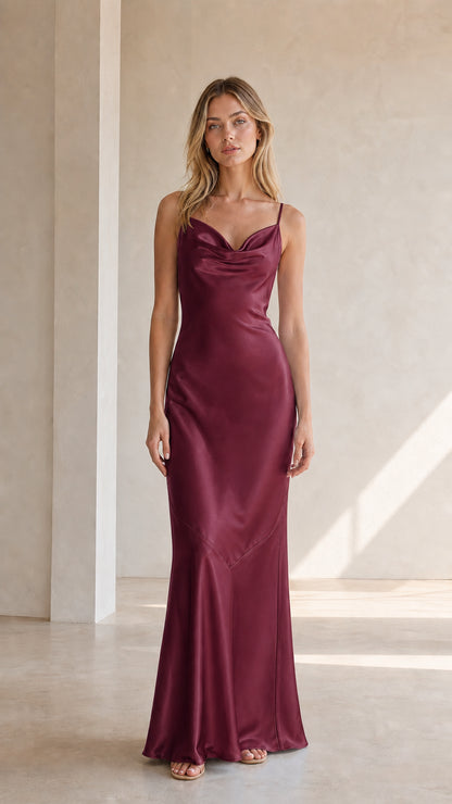 Front view of model wearing burgundy satin cowl neck maxi dress