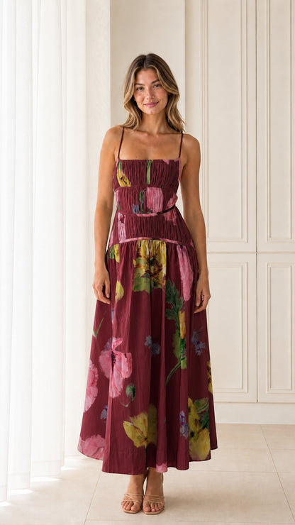 Front view of model wearing Burgundy floral smocked maxi dress