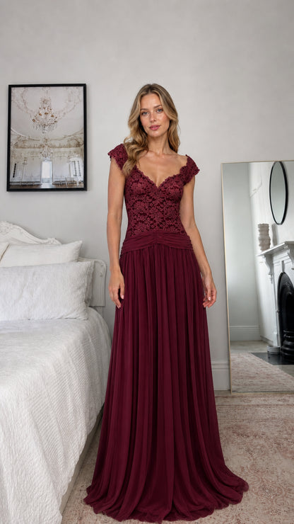 Front view of model wearing burgundy lace evening dress