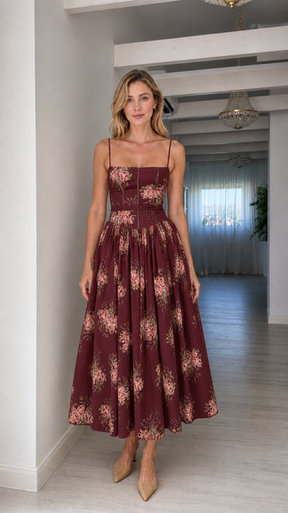 Woman wearing burgundy floral midi dress
