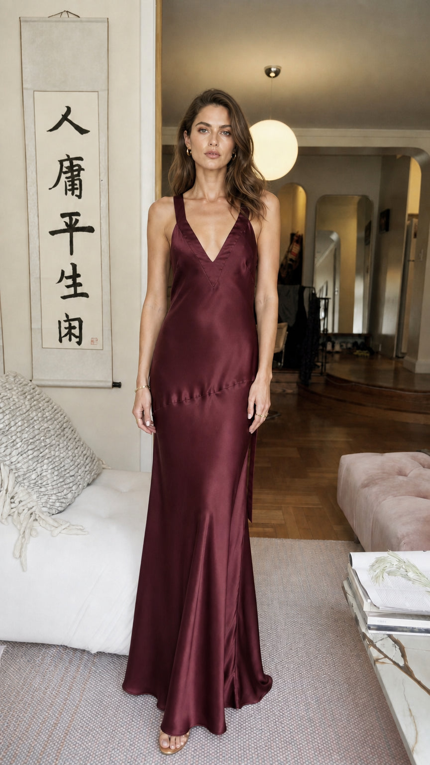 Front view of model wearing burgundy satin V-neck maxi dress