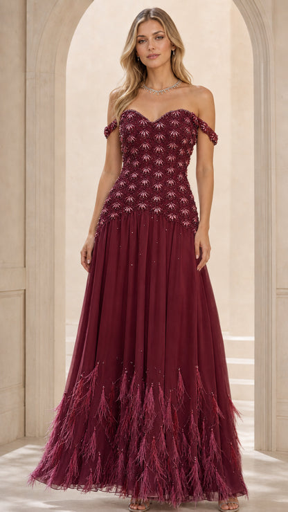 Front view of burgundy evening gown with feathered hem