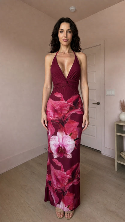 Model wearing burgundy and pink floral print halter maxi dress